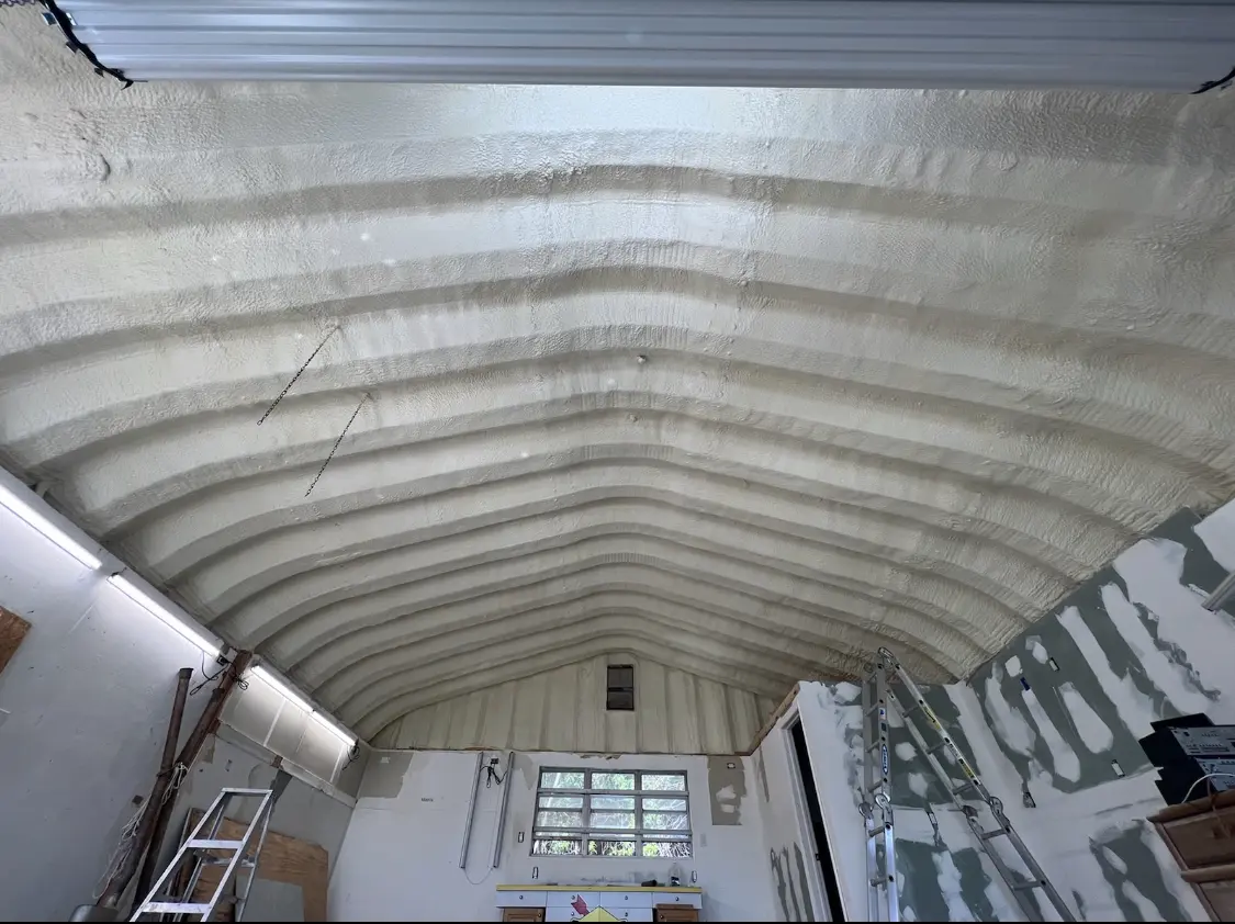 Spray polyurethane foam applied to the underside of a metal roof deck in Oswego